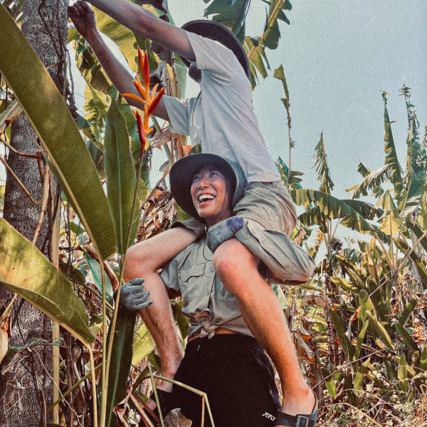 Jenny carrying Jonas onsite at a permaculture project in Tabanan, Bali.