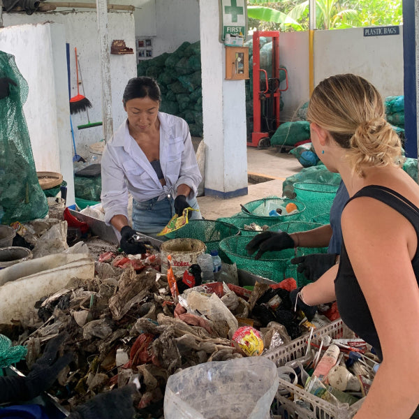 Jenny Hsu at a sorting facility to separate out waste from a recent river clean up.