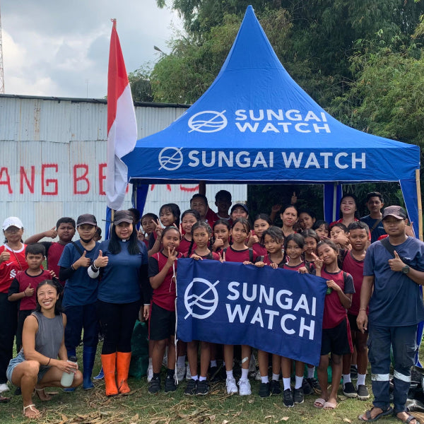 Jenny with clean up crew and local middle school students at a Sungai Watch river clean up in 2025.